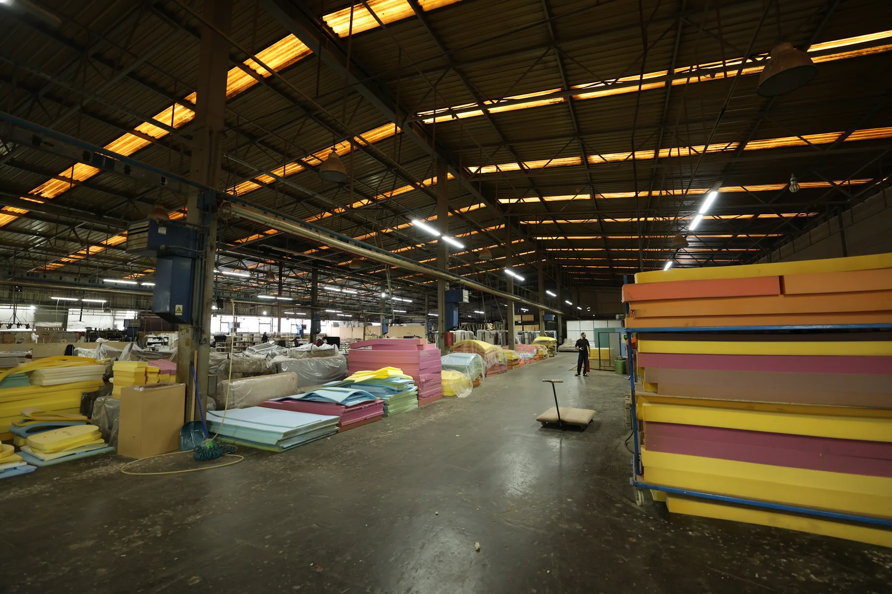 Wide view across Divani's furniture production floor