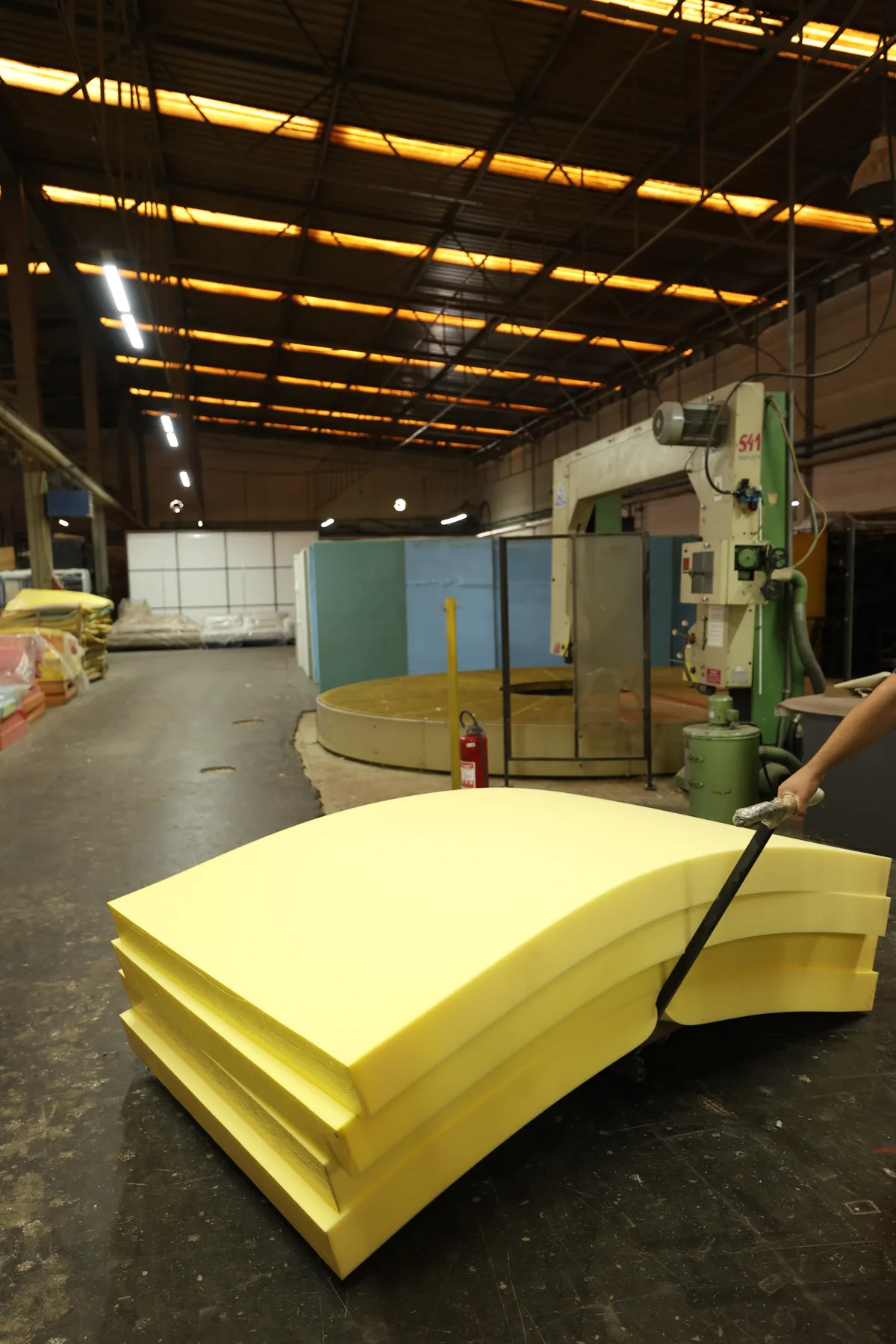 Foam components being handled during furniture production