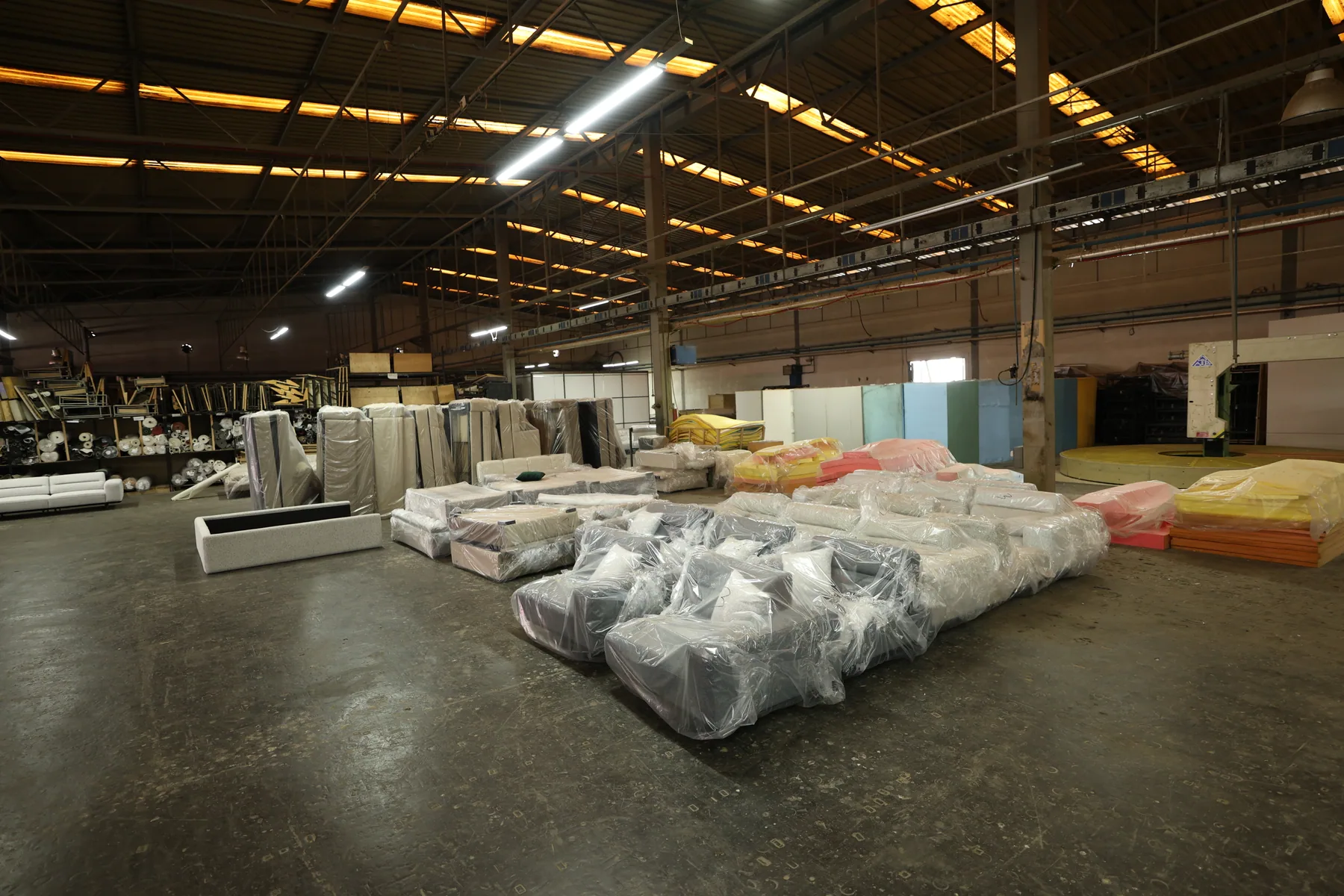 Panoramic view of covered furniture across the Divani production facility