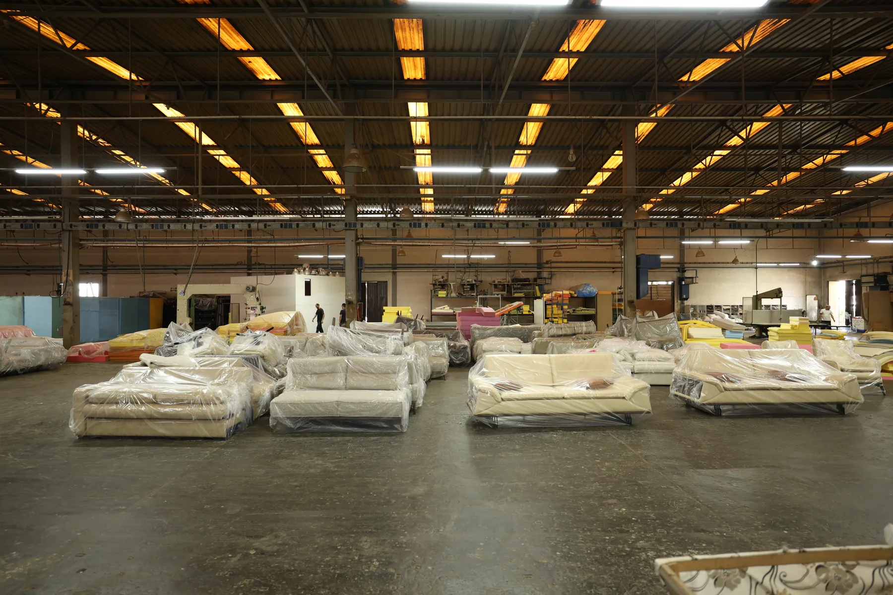 Furniture pieces arranged across the Divani production floor
