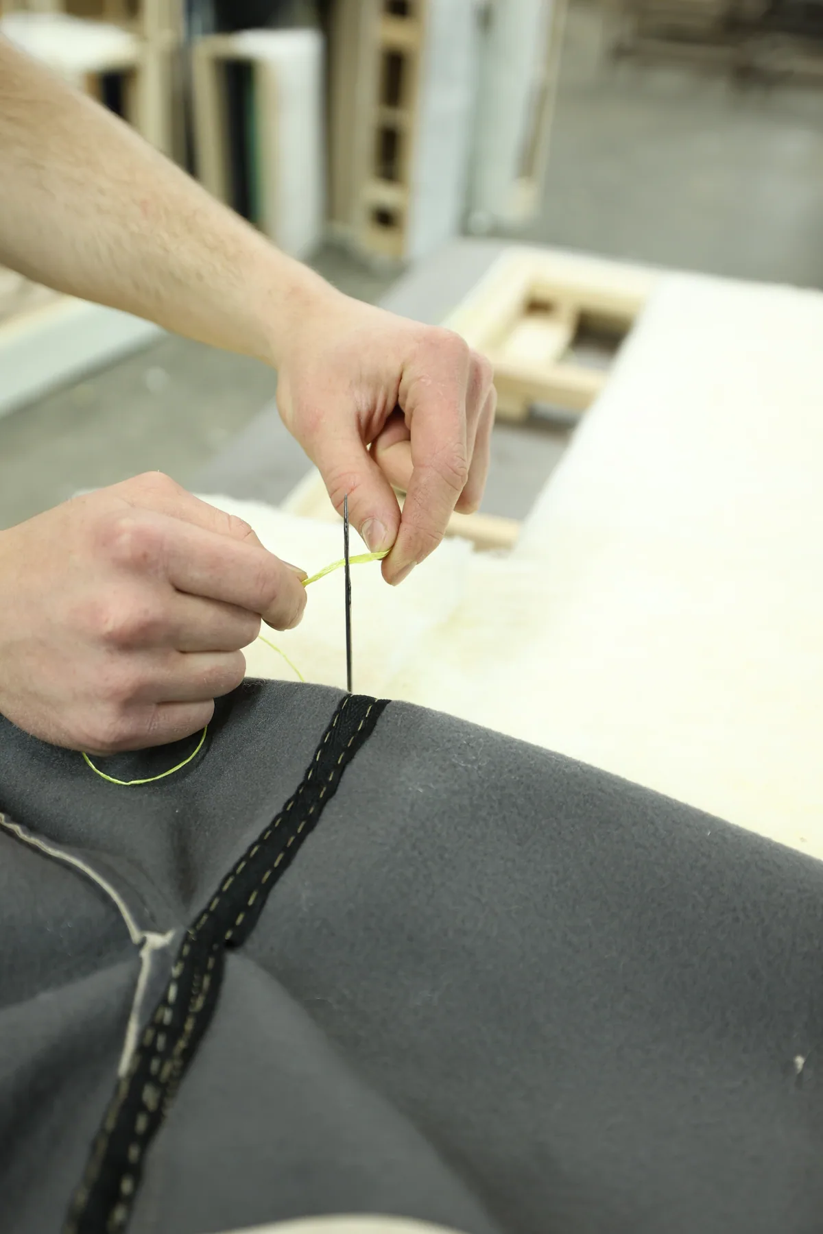 Detailed upholstery work by hand during Divani furniture production