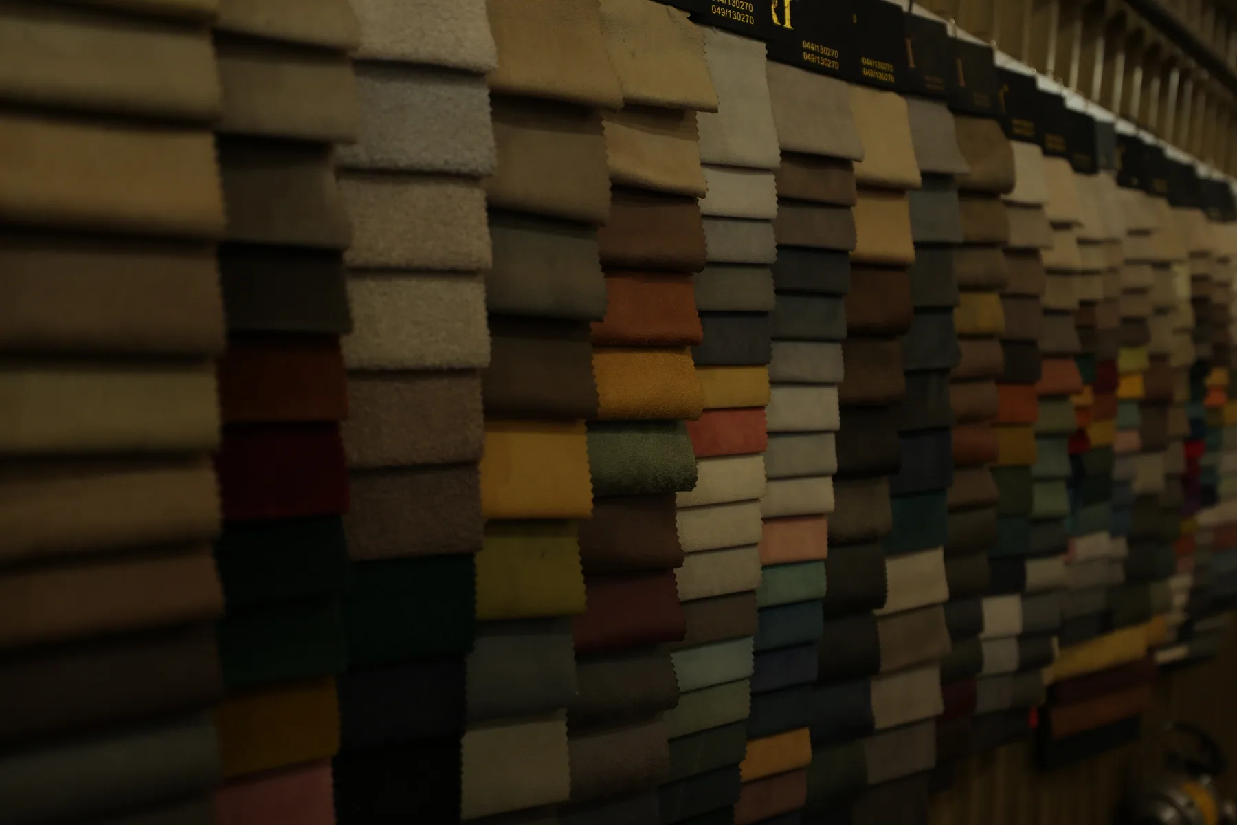 Rows of upholstery fabric samples at the Divani facility